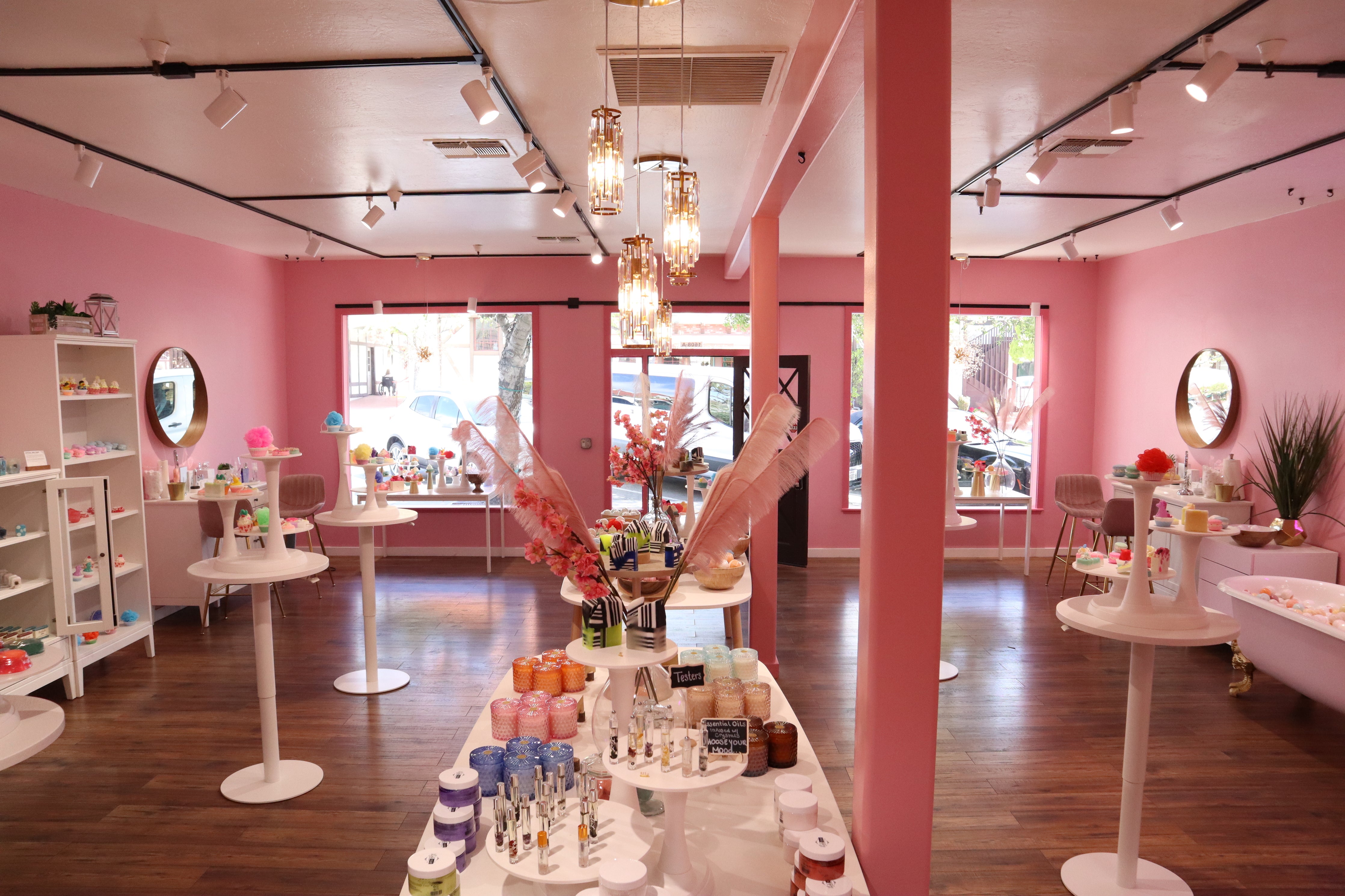 The interior of Skinderella in Solvang, California. Bright pink walls and shelves of soaps.
